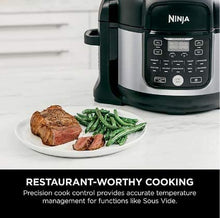 Load image into Gallery viewer, Ninja Foodi 6.5qt Pro 11-in-1 FD302 Sous Vide, Pressure Cooker, Air Fryer/Crisper, Dehydrate, Slow Cook, Steam, Make Yogurt, Bake/Roast, Sear/Sauté, and Keep Foods Warm Inside the Pot, with a Stainless Finish PLUS 2 Accessories