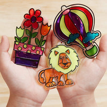 Load image into Gallery viewer, Made By Me Create Your Own Window Art by Horizon Group USA, Paint Your Own Suncatchers. Kit Includes 12 Pre-Printed Suncatchers + DIY Acetate Sheet, Window Paint, Suction Cups, &amp; More, Assorted Colors