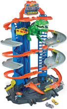 Load image into Gallery viewer, Hot Wheels City Ultimate Garage Track Set with 2 Toy Cars, Garage Playset Features Multi-Level Racetrack, Moving T-Rex Dino &amp; Storage for 100+ 1:64 Scale Vehicles, Toy Gift for Kids 3 Years &amp; Older