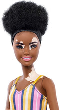 Load image into Gallery viewer, Barbie Fashionistas Doll with Vitiligo and Curly Brunette Hair Wearing Striped Dress and Accessories, for 3 to 8 Year Olds