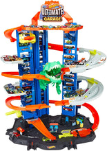 Load image into Gallery viewer, Hot Wheels City Ultimate Garage Track Set with 2 Toy Cars, Garage Playset Features Multi-Level Racetrack, Moving T-Rex Dino &amp; Storage for 100+ 1:64 Scale Vehicles, Toy Gift for Kids 3 Years &amp; Older