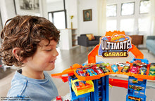 Load image into Gallery viewer, Hot Wheels City Ultimate Garage Track Set with 2 Toy Cars, Garage Playset Features Multi-Level Racetrack, Moving T-Rex Dino &amp; Storage for 100+ 1:64 Scale Vehicles, Toy Gift for Kids 3 Years &amp; Older