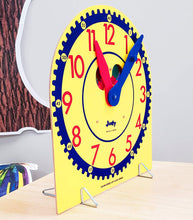 Load image into Gallery viewer, Carson Dellosa Judy Clock—Teaching Kids to Tell Time, Color-Coded Hour and Minute Hands, Toy Clock with Metal Stand, Classroom or Homeschool (13&quot; x 12&quot;)