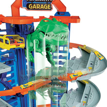 Load image into Gallery viewer, Hot Wheels City Ultimate Garage Track Set with 2 Toy Cars, Garage Playset Features Multi-Level Racetrack, Moving T-Rex Dino &amp; Storage for 100+ 1:64 Scale Vehicles, Toy Gift for Kids 3 Years &amp; Older