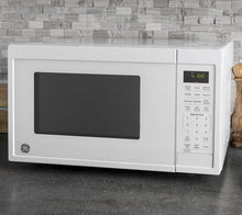 Load image into Gallery viewer, GE Appliances Black Countertop Microwave