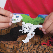 Load image into Gallery viewer, Kinetic Sand, Dino Dig Playset with 10 Hidden Dinosaur Bones to Discover, for Kids Aged 6 and up