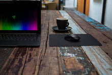Load image into Gallery viewer, The weave on the Razer Goliathus speed edition is pulled taut to create a slick and seamless surface enabling your gaming mouse to glide quickly with zero hindrance to land those snap shots. The weave also provides a nice, comfortable feel under your han