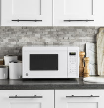 Load image into Gallery viewer, GE Appliances Black Countertop Microwave